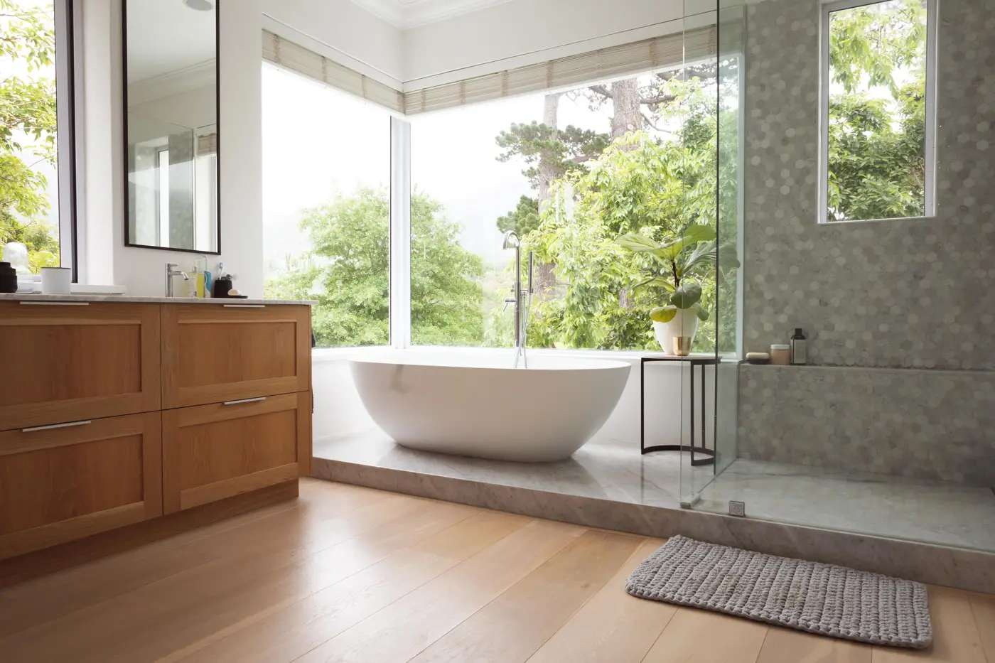 Bathroom with freestanding tub and large window